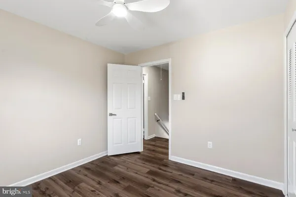 a bathroom with a toilet a sink and a mirror