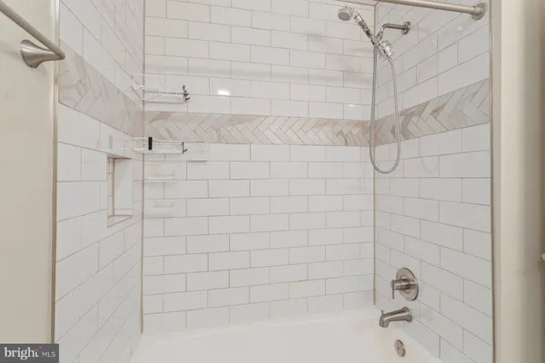 a view of a sink and washer dryer