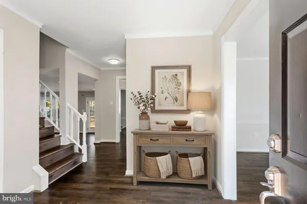 a view of entryway with wooden floor