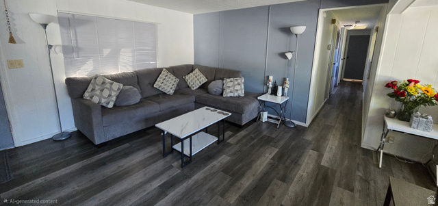 1500 Angel Street North, Unit 53 Layton, UT 84041 - Photo 3 of 20 Spacious living area featuring wood-finish flooring, a neutral color palette, and a textured accent wall