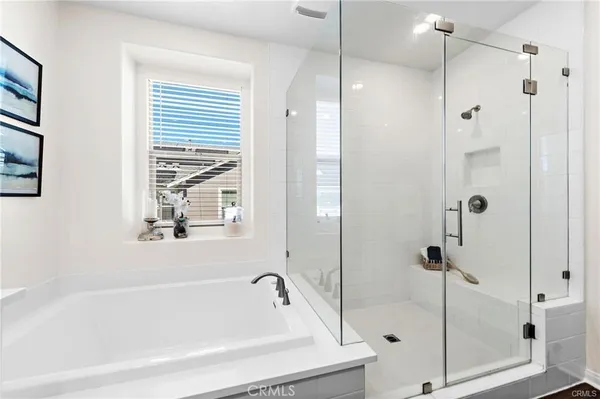 a bathroom with a bathtub and a shower