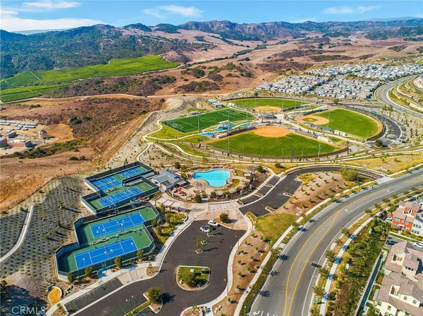 an aerial view of residential houses with outdoor space