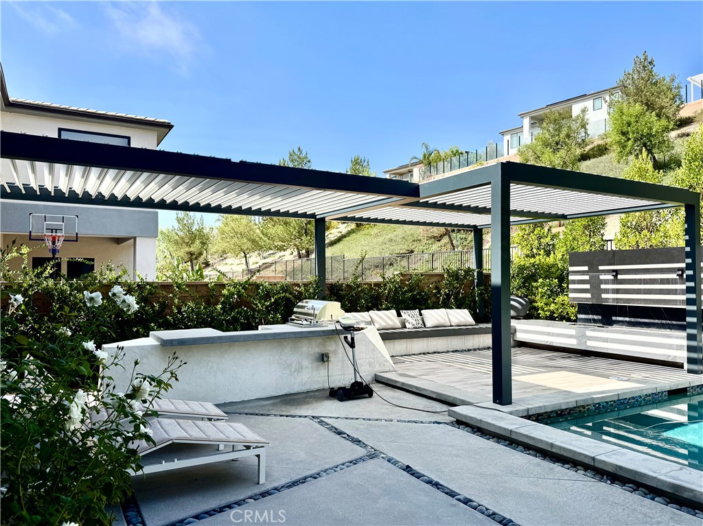 20401 Aberdeen Lane Porter Ranch, CA 91326 - Photo 20 of 21 a building outdoor space with patio furniture and potted plants