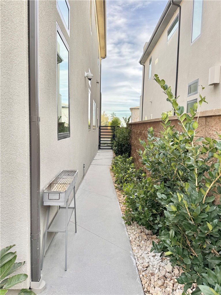 20401 Aberdeen Lane Porter Ranch, CA 91326 - Photo 21 of 21 a balcony with chairs and a potted plant