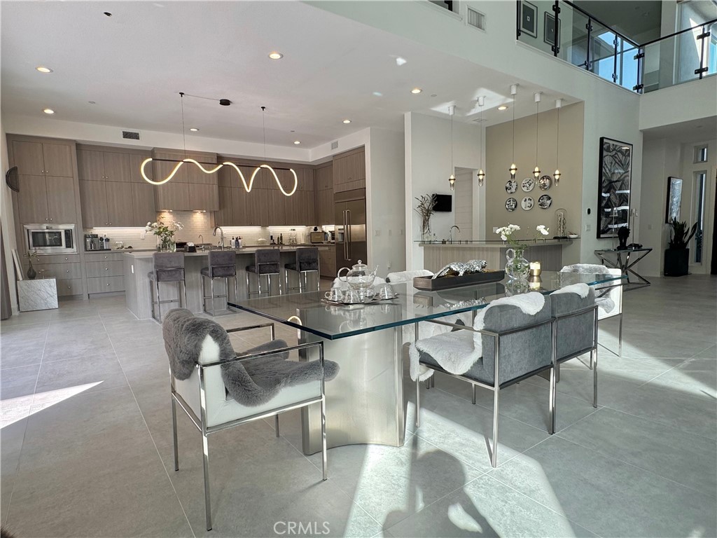 20401 Aberdeen Lane Porter Ranch, CA 91326 - Photo 3 of 21 a kitchen with a table and chairs