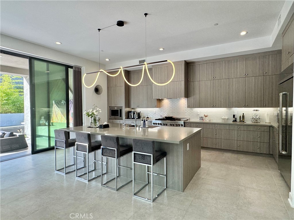20401 Aberdeen Lane Porter Ranch, CA 91326 - Photo 4 of 21 a kitchen with a sink and a stove