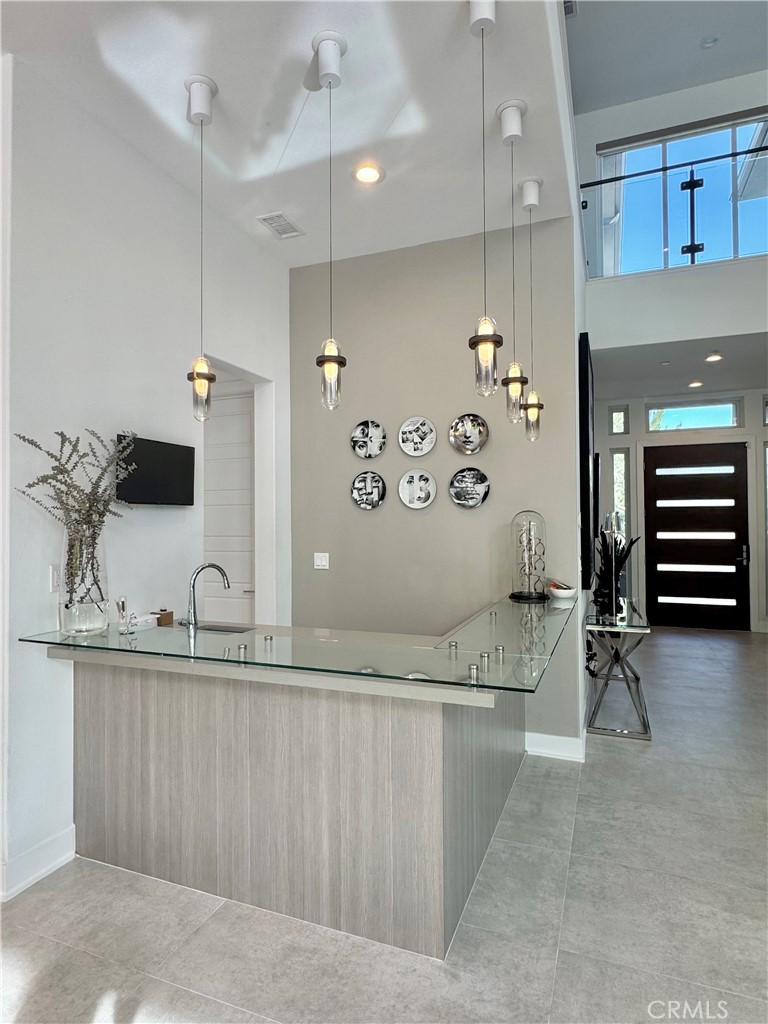 20401 Aberdeen Lane Porter Ranch, CA 91326 - Photo 6 of 21 a view of a kitchen with a sink and cabinets
