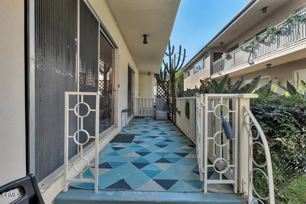 a view of a balcony with wooden floor