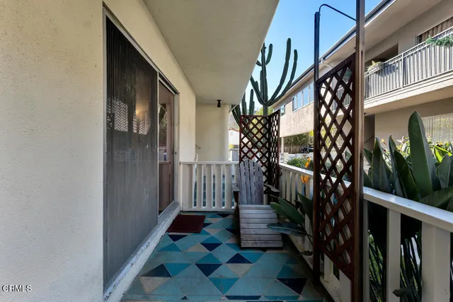 a view of a pathway of a house with wooden floor and stairs