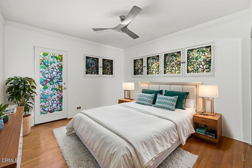 917 West W Victoria Street Santa Barbara, CA 93101 - Photo 14 of 28 a bedroom with bed and a potted plant