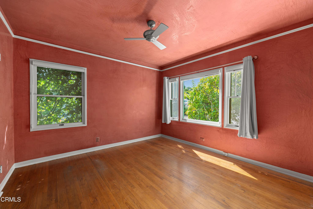 917 West W Victoria Street Santa Barbara, CA 93101 - Photo 15 of 28 a view of an empty room with wooden floor and a window