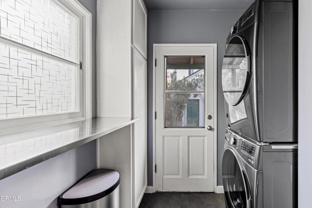 917 West W Victoria Street Santa Barbara, CA 93101 - Photo 19 of 28 a bathroom with a sink a mirror a toilet and a window