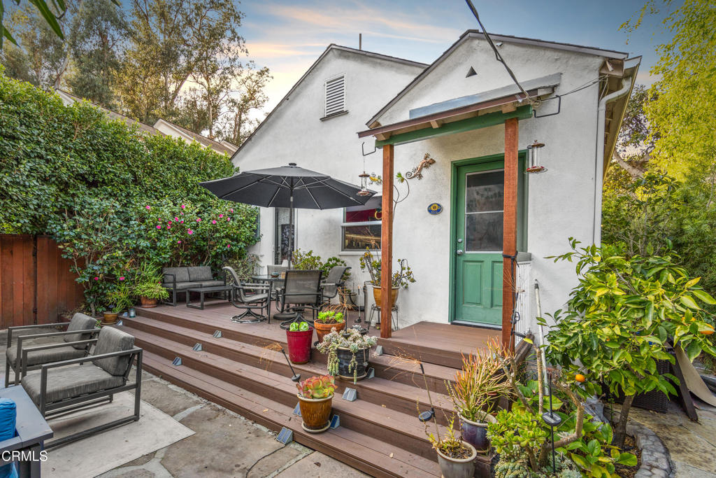 917 West W Victoria Street Santa Barbara, CA 93101 - Photo 22 of 28 a view of a patio with table and chairs under an umbrella