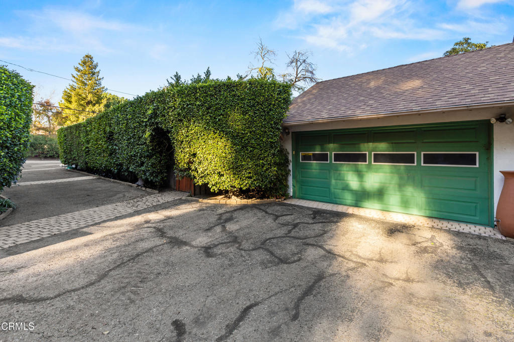 917 West W Victoria Street Santa Barbara, CA 93101 - Photo 26 of 28 a backyard of a house with plants and palm tree