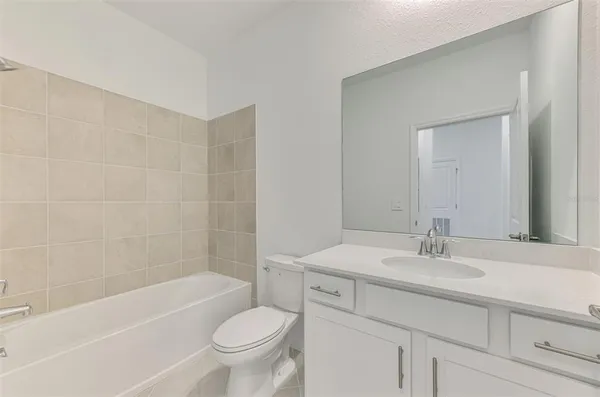 a bathroom with a sink a toilet and a bathtub