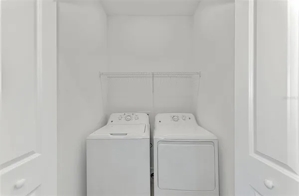 a utility room with dryer and washer