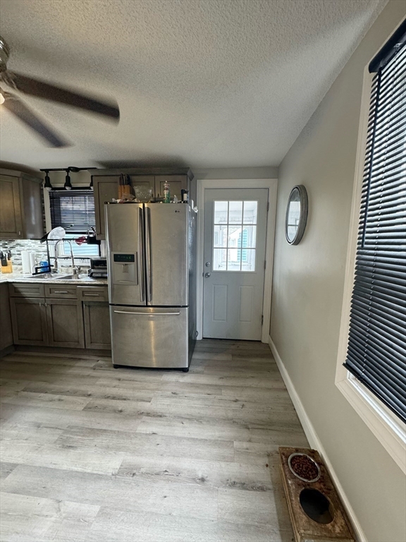21 Morison Terrace Springfield, MA 01104 - Photo 12 of 42 a kitchen with refrigerator and window