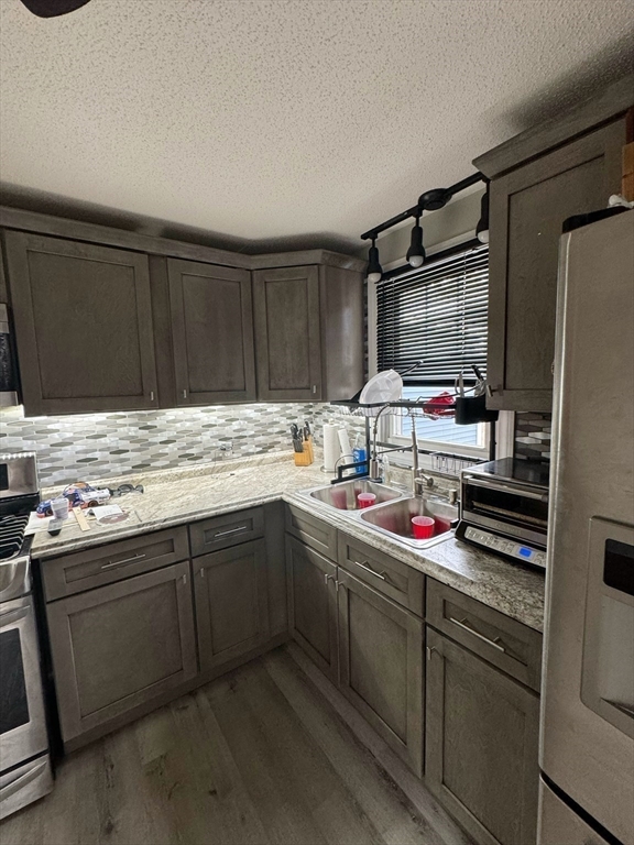 21 Morison Terrace Springfield, MA 01104 - Photo 13 of 42 a kitchen with stainless steel appliances a sink and cabinets