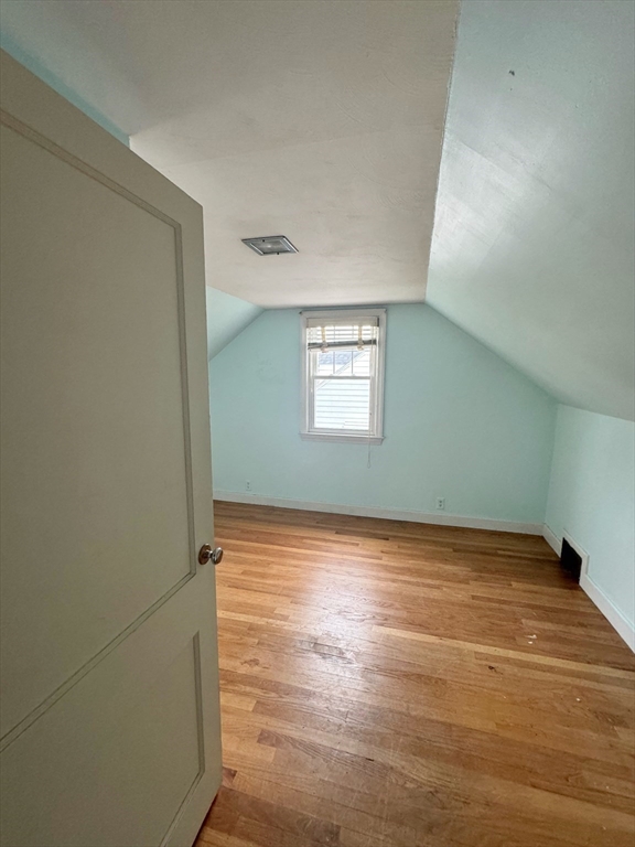 21 Morison Terrace Springfield, MA 01104 - Photo 28 of 42 a view of an empty room with wooden floor and a window