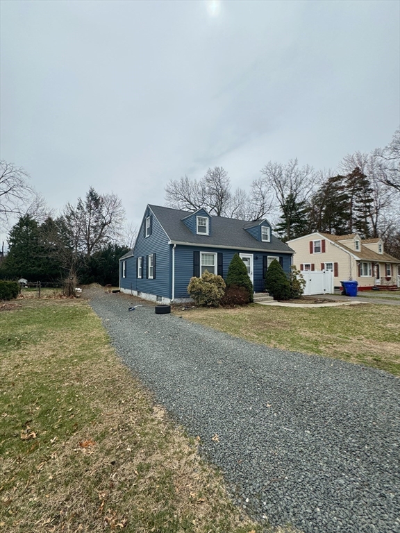 21 Morison Terrace Springfield, MA 01104 - Photo 40 of 42 a front view of a house with a yard and garage