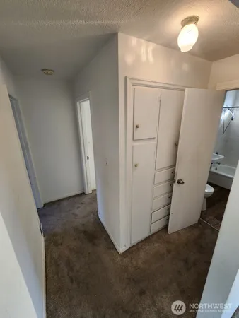 a view of a storage & utility room with a sink