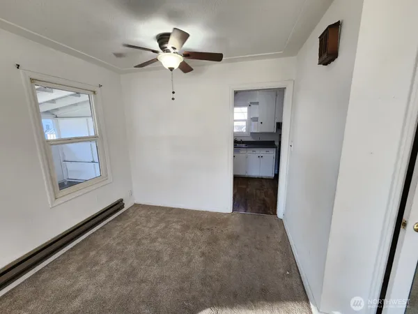 a view of an empty room with a bathroom