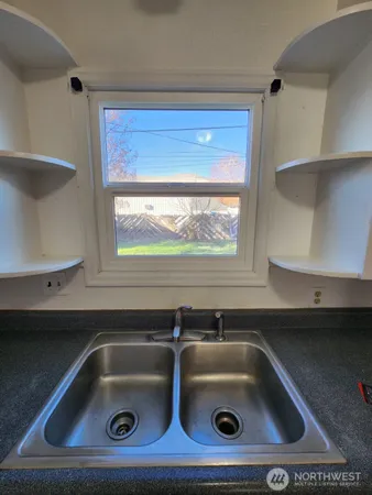 a bathroom with a sink a vanity and mirror