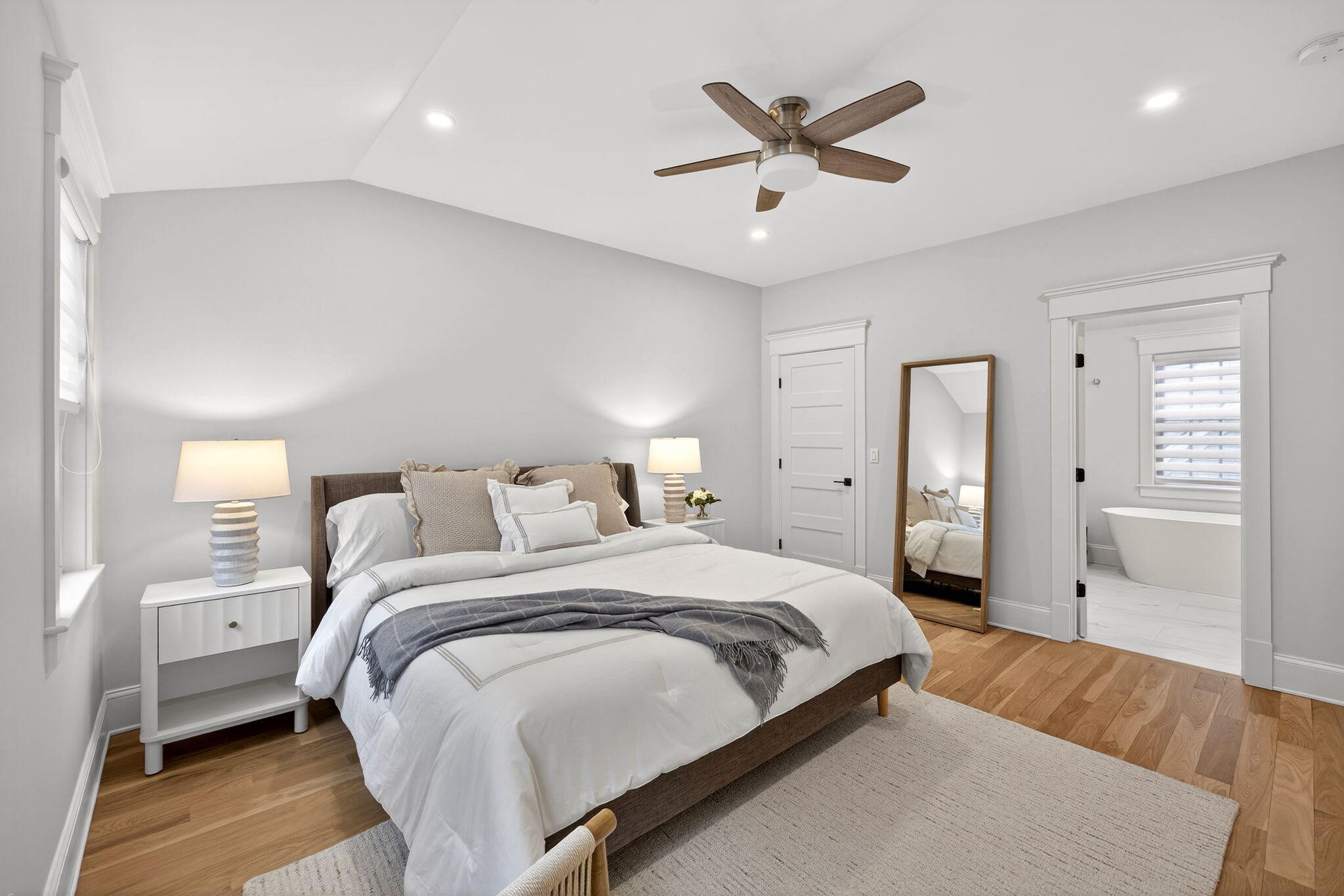 255 Old Main Road, Unit 1B North Falmouth, MA 02556 - Photo 16 of 88 a bedroom with a large bed and a ceiling fan