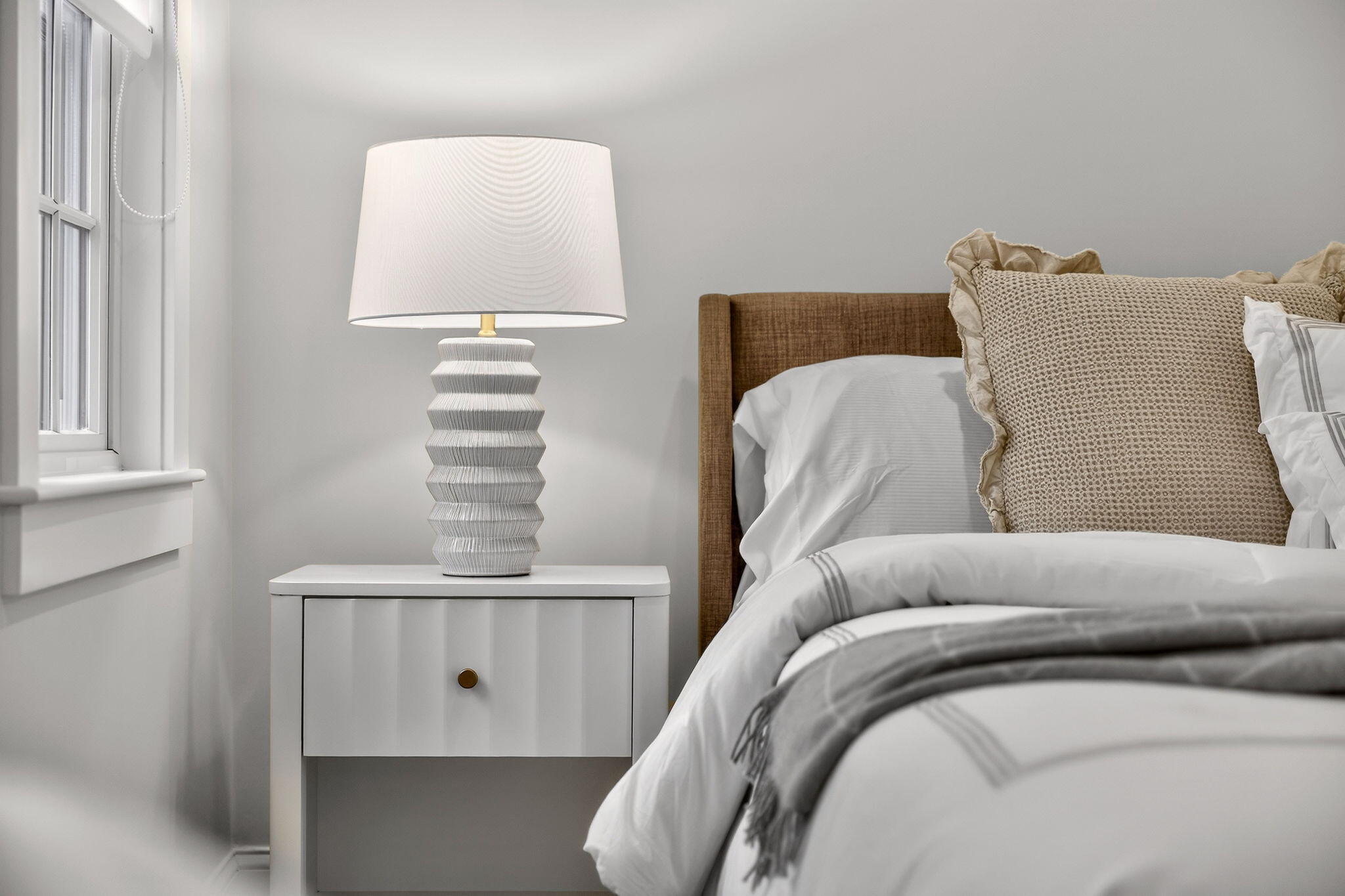 255 Old Main Road, Unit 1B North Falmouth, MA 02556 - Photo 17 of 88 a living room with a bed and a window