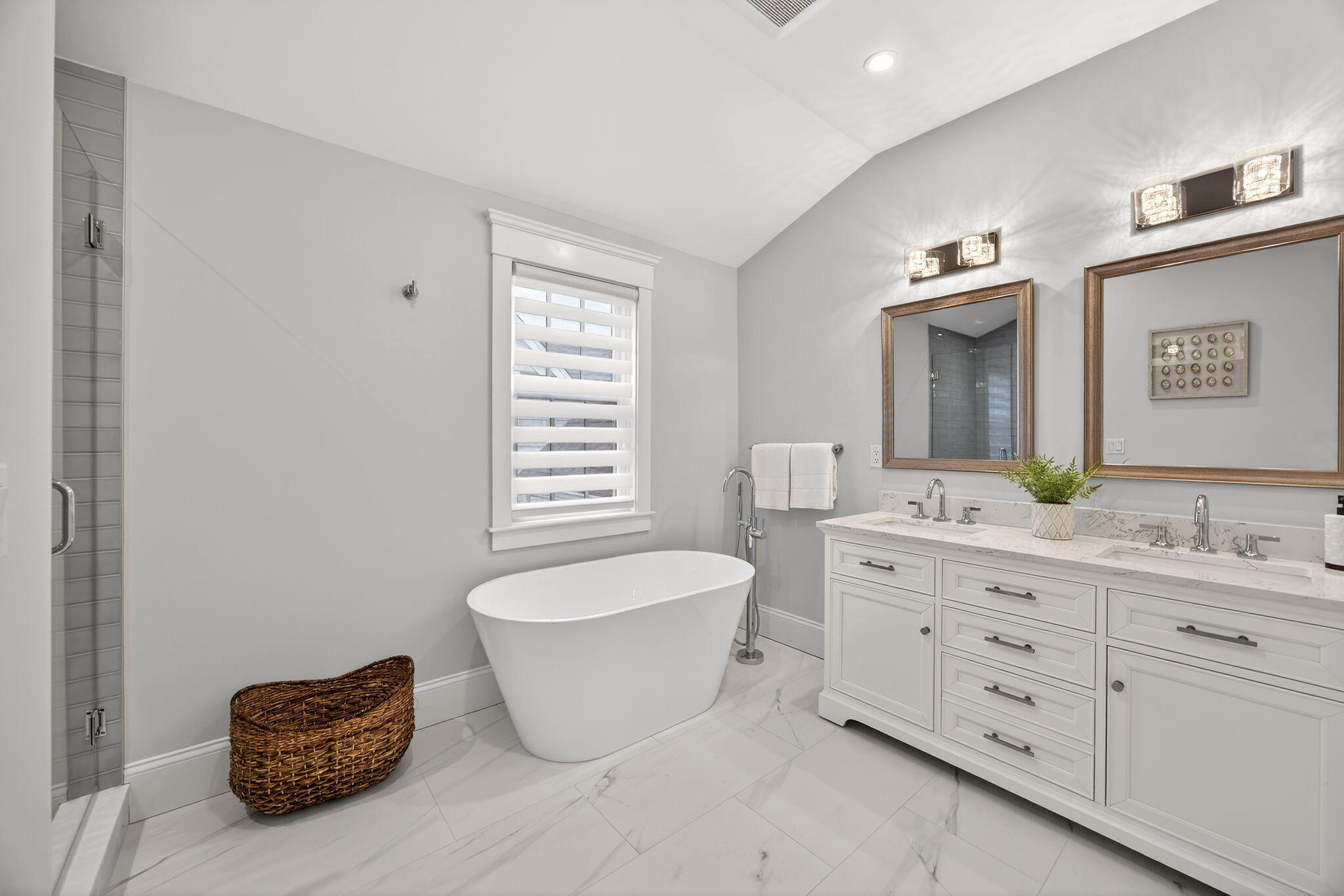255 Old Main Road, Unit 1B North Falmouth, MA 02556 - Photo 20 of 88 a spacious bathroom with a double vanity sink a mirror and a bathtub