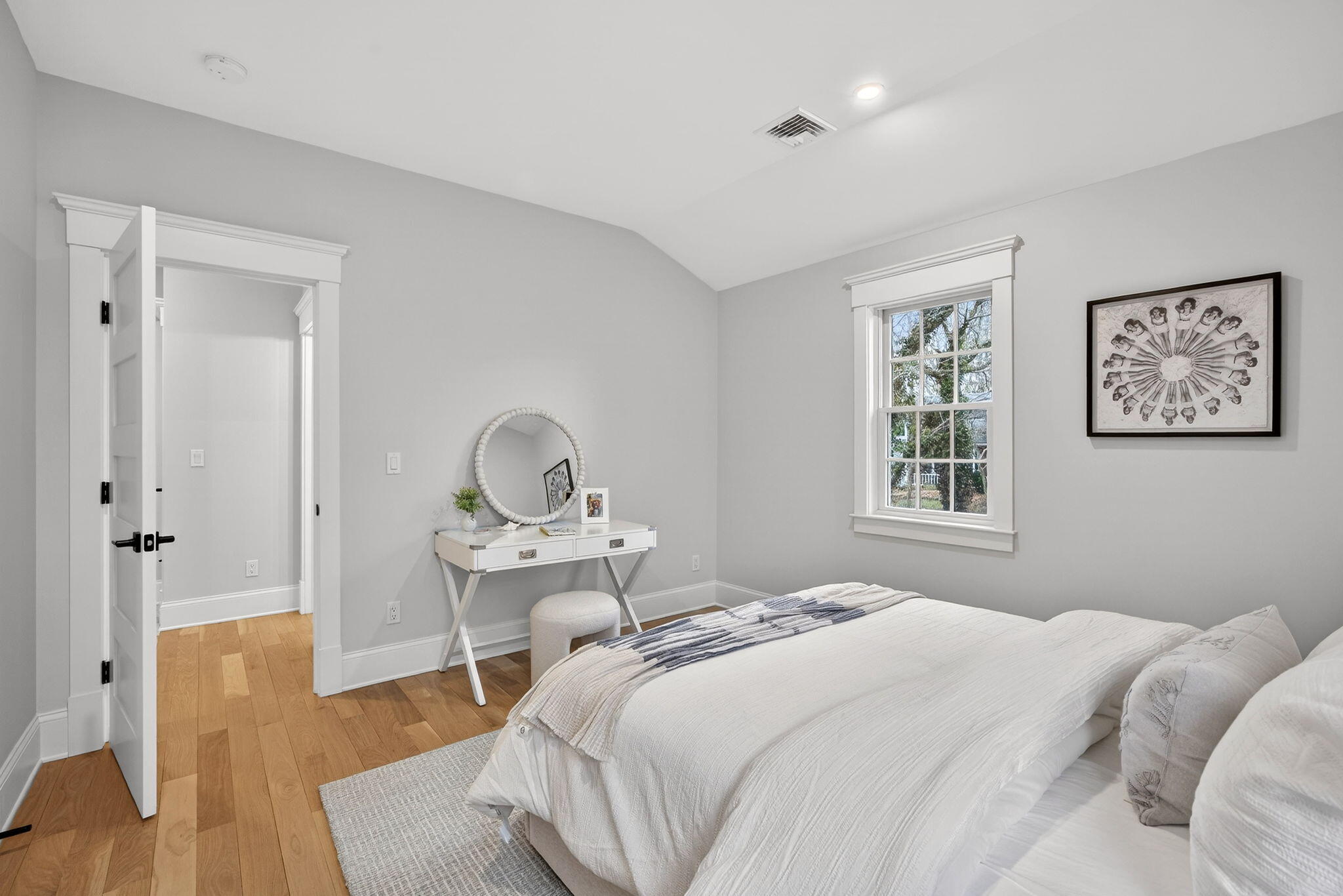 255 Old Main Road, Unit 1B North Falmouth, MA 02556 - Photo 28 of 88 a bedroom with a bed and wooden floor