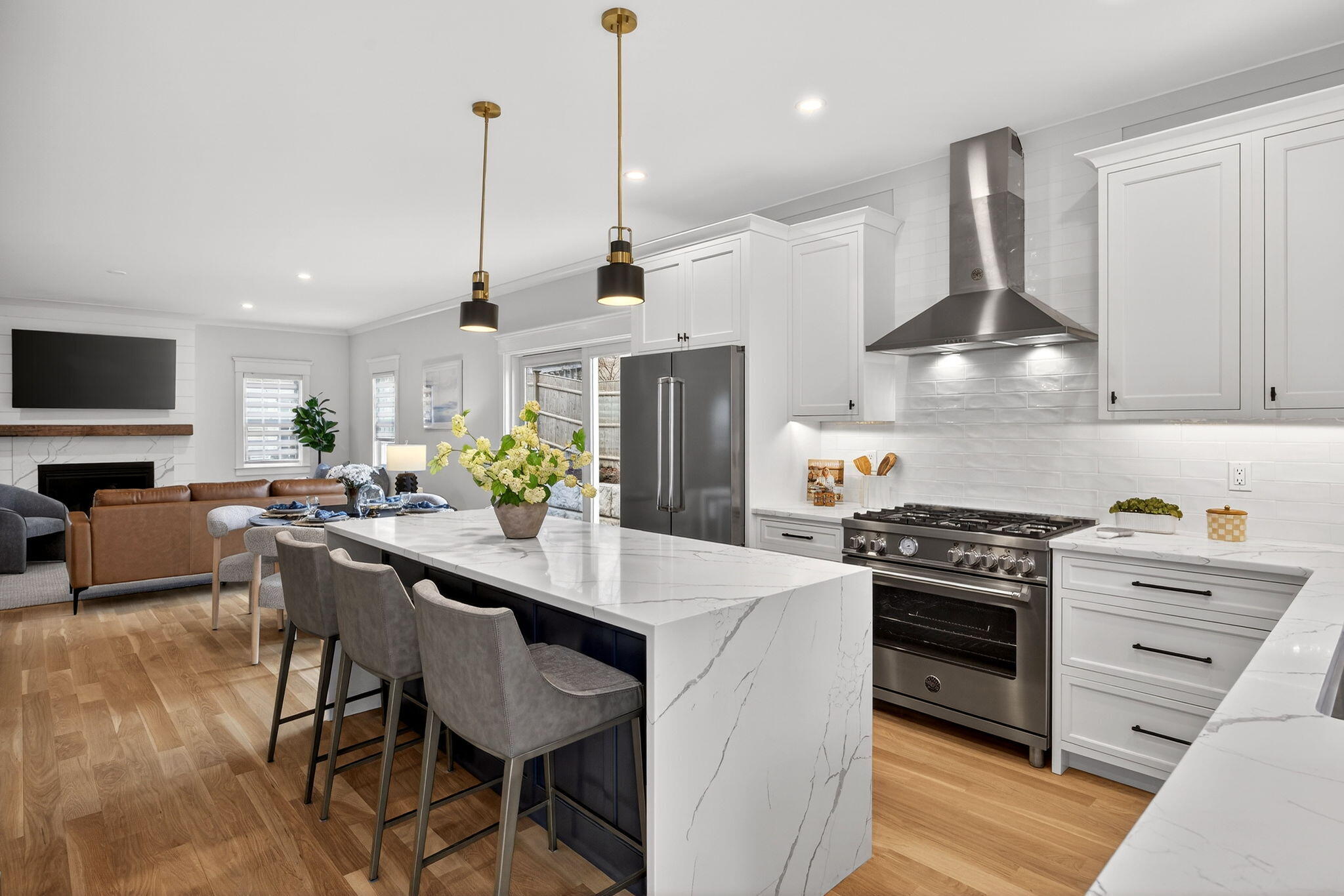 255 Old Main Road, Unit 1B North Falmouth, MA 02556 - Photo 3 of 88 a kitchen with stainless steel appliances kitchen island granite countertop a stove a sink a refrigerator and a cabinets