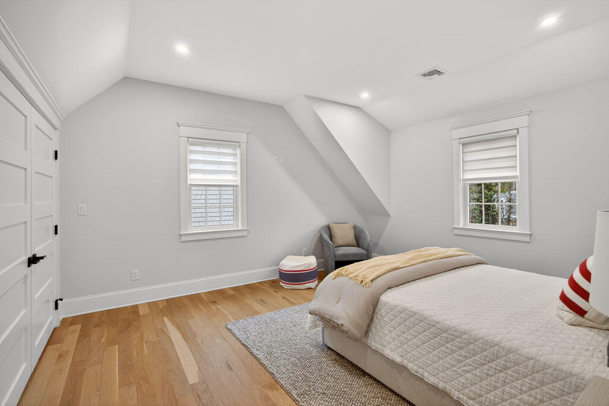 255 Old Main Road, Unit 1B North Falmouth, MA 02556 - Photo 34 of 88 a bedroom with a bed and wooden floor
