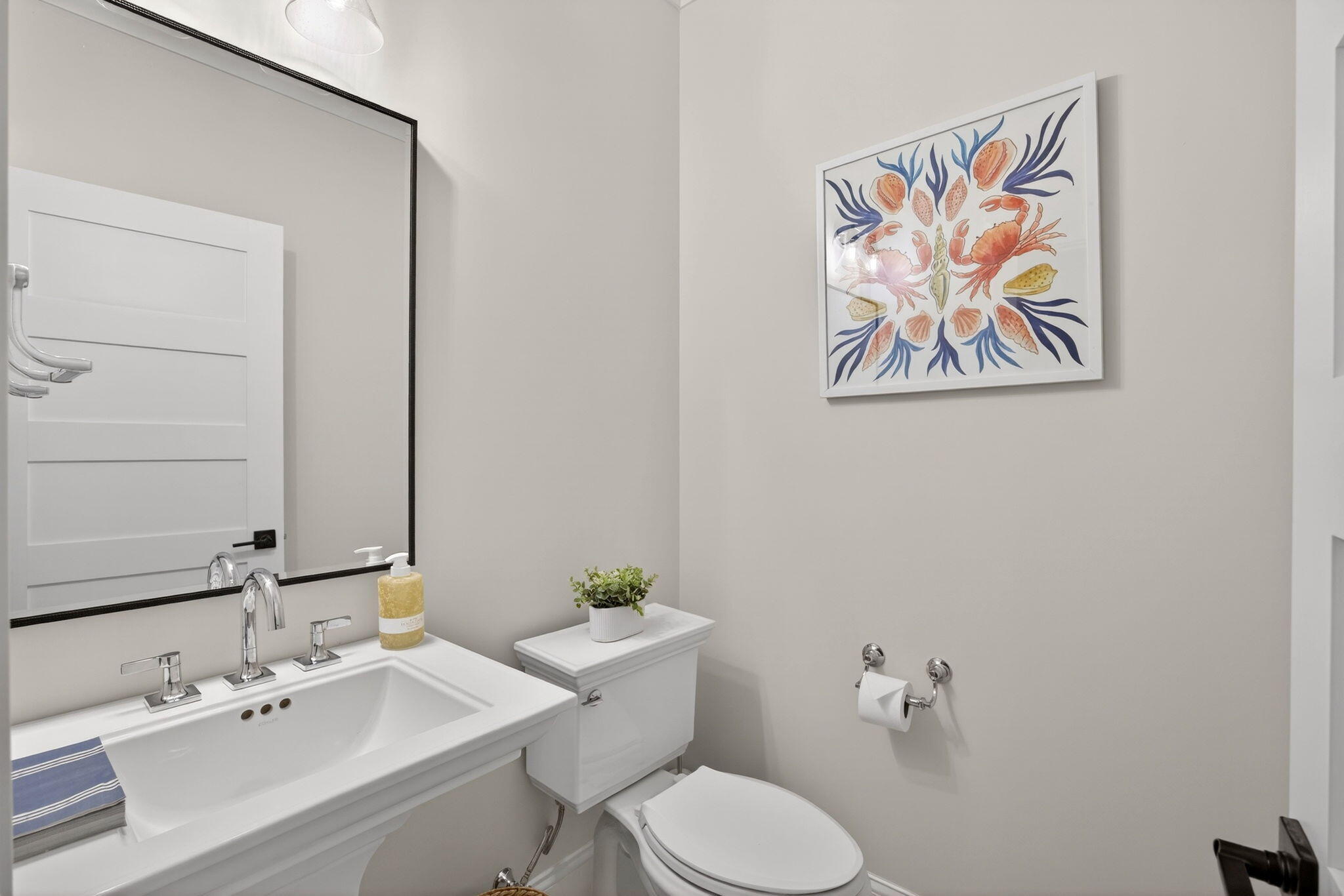 255 Old Main Road, Unit 1B North Falmouth, MA 02556 - Photo 39 of 88 a bathroom with a sink mirror and toilet