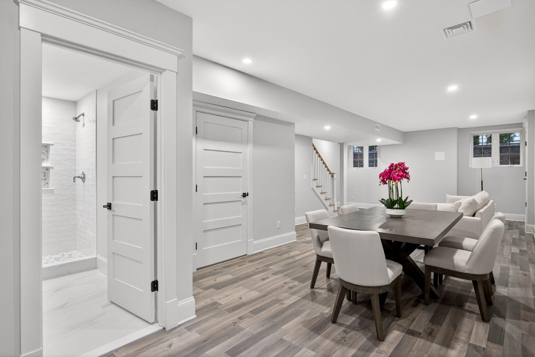 255 Old Main Road, Unit 1B North Falmouth, MA 02556 - Photo 43 of 88 a view of a dining room with furniture wooden floor and a chandelier