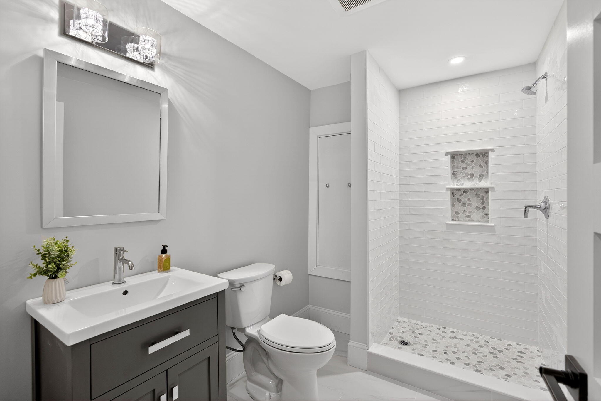 255 Old Main Road, Unit 1B North Falmouth, MA 02556 - Photo 44 of 88 a bathroom with a sink toilet and shower