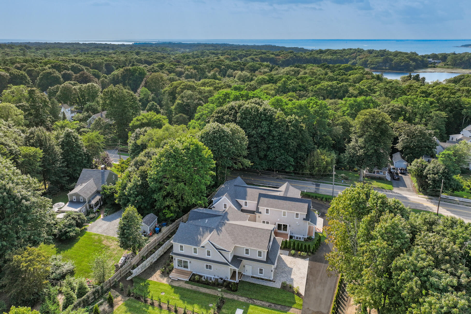 255 Old Main Road, Unit 1B North Falmouth, MA 02556 - Photo 52 of 88 an aerial view of a house with garden space and street view