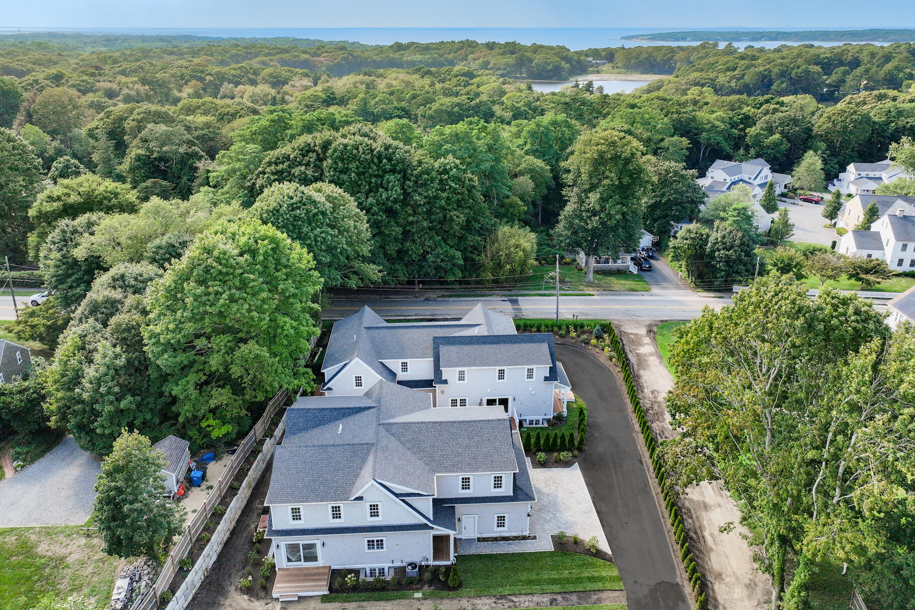 255 Old Main Road, Unit 1B North Falmouth, MA 02556 - Photo 55 of 88 an aerial view of a house with a yard