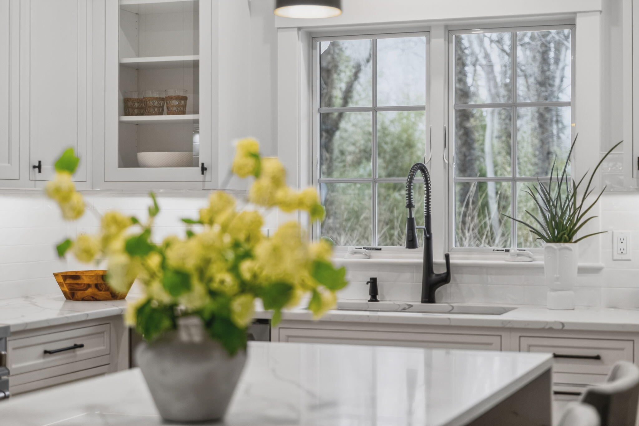 255 Old Main Road, Unit 1B North Falmouth, MA 02556 - Photo 59 of 88 a vase of flowers sitting on a table with a window
