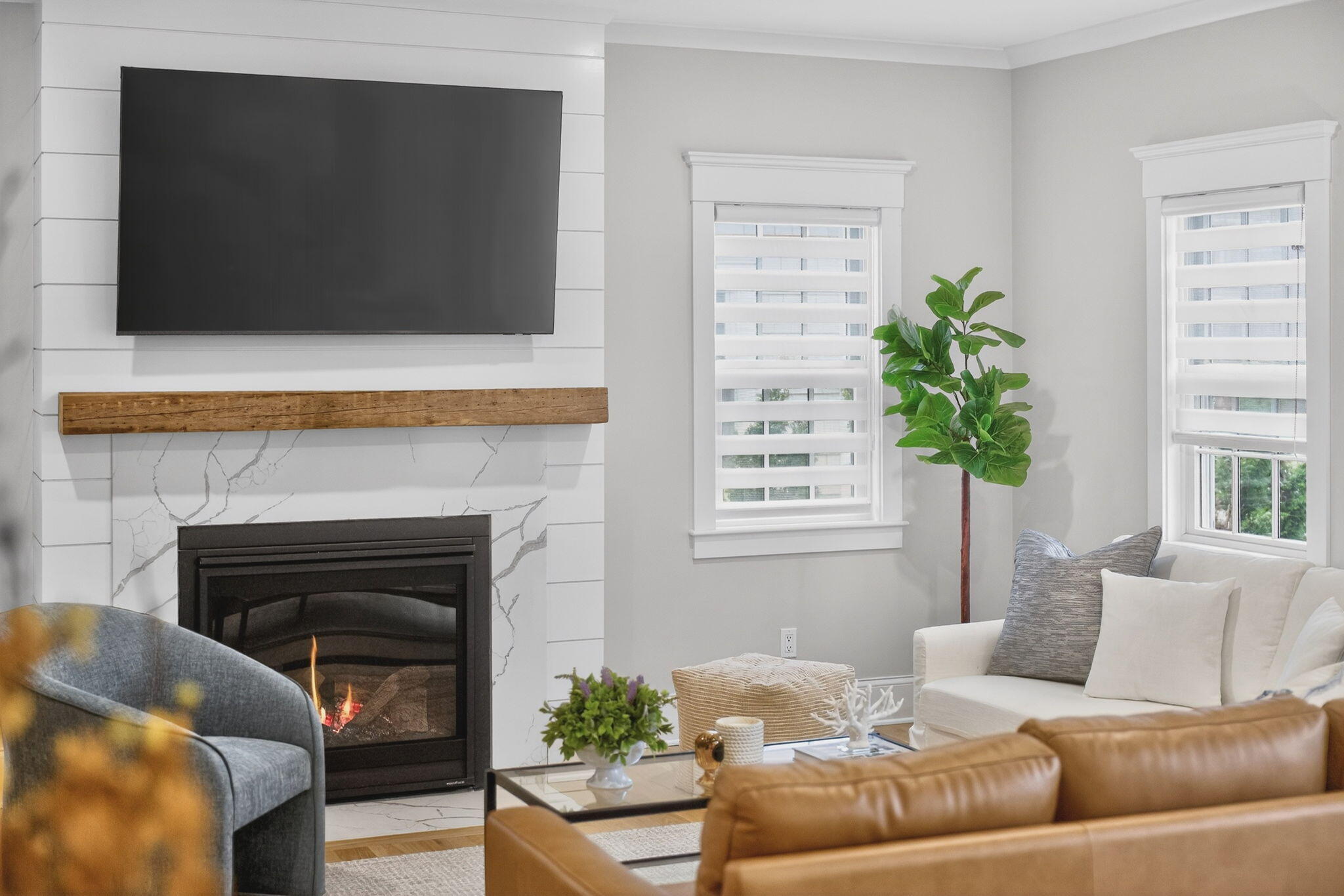 255 Old Main Road, Unit 1B North Falmouth, MA 02556 - Photo 65 of 88 a living room with furniture a flat screen tv and a fireplace