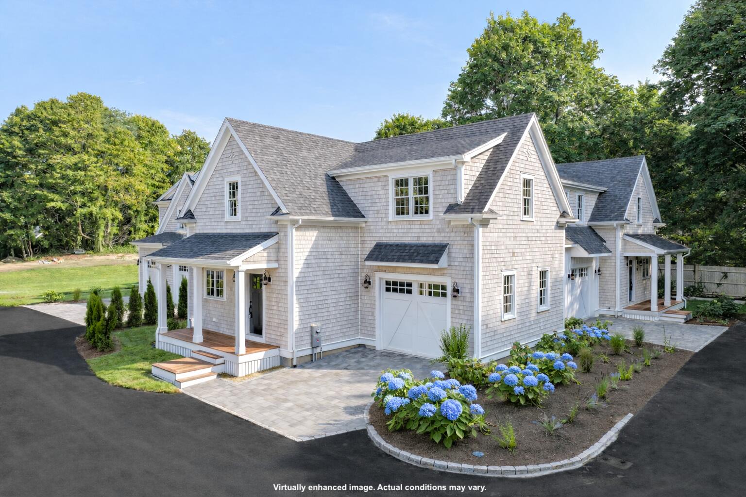255 Old Main Road, Unit 1B North Falmouth, MA 02556 - Photo 67 of 88 a view of a house with a yard and potted plants