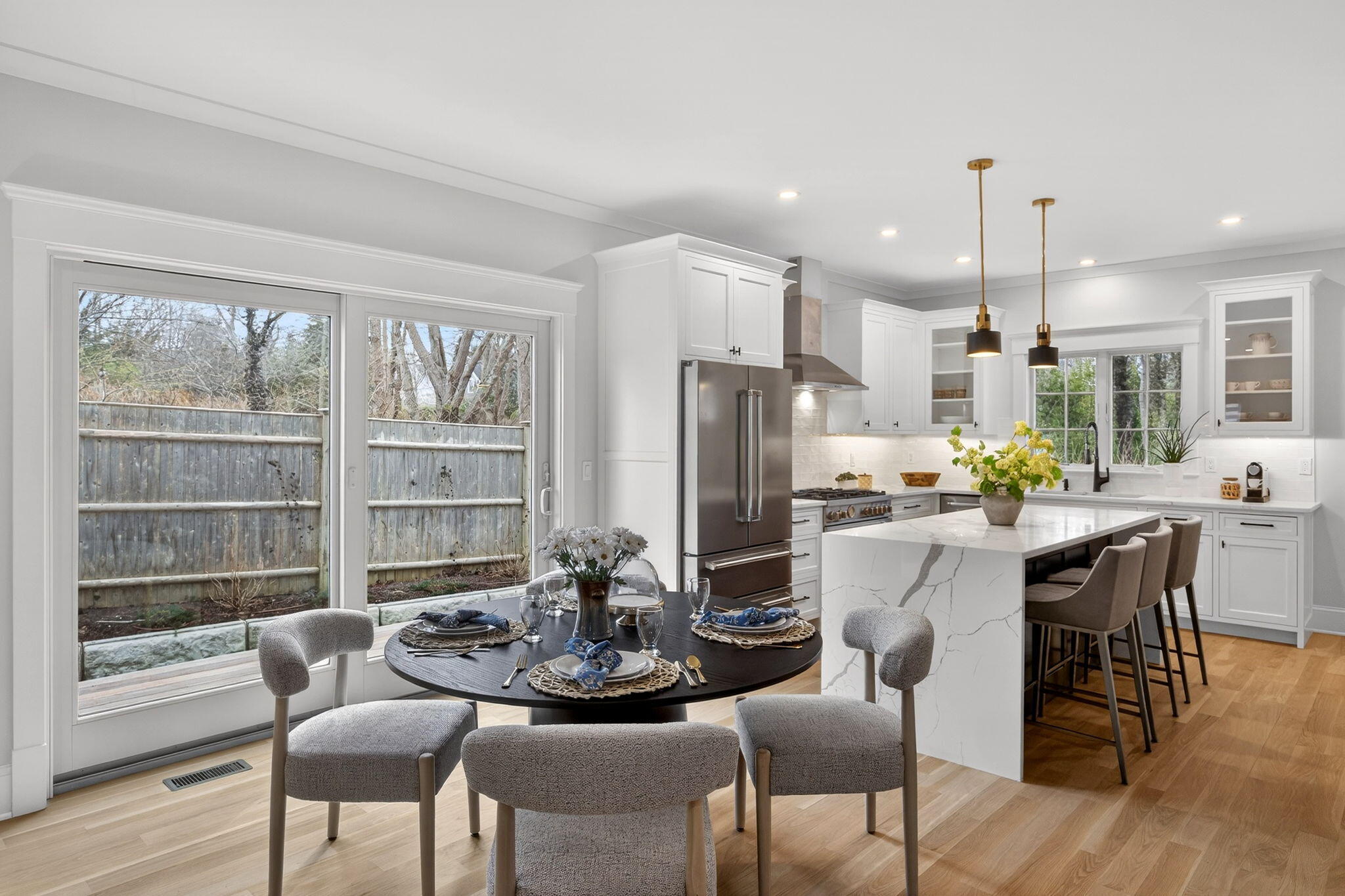 255 Old Main Road, Unit 1B North Falmouth, MA 02556 - Photo 7 of 88 a dining room with furniture a chandelier and wooden floor