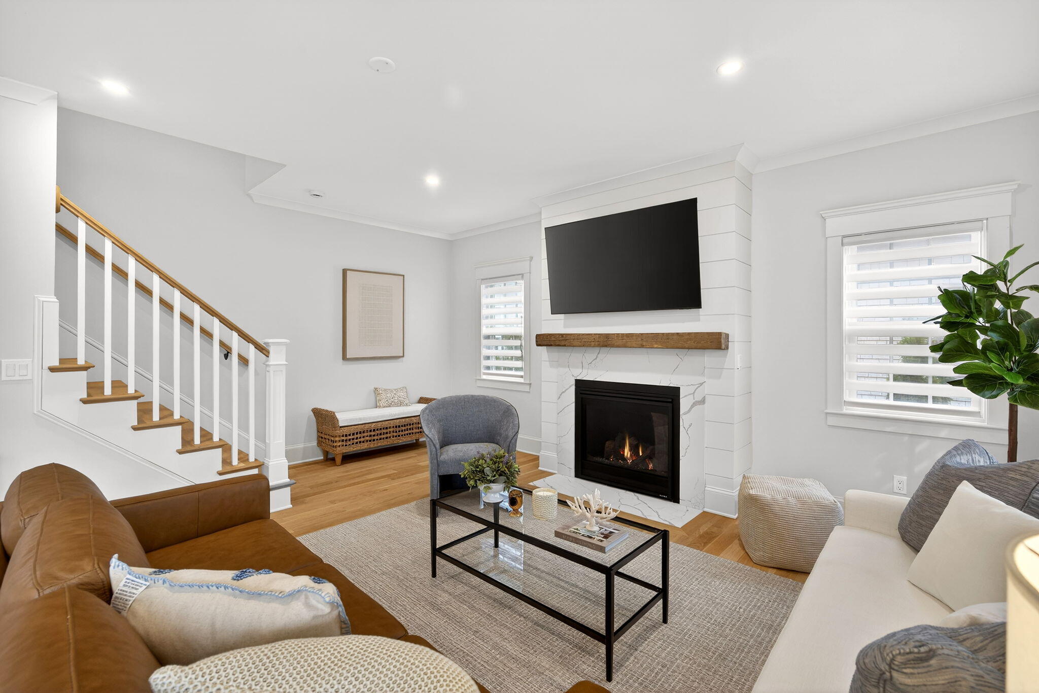 255 Old Main Road, Unit 1B North Falmouth, MA 02556 - Photo 9 of 88 a living room with furniture a fireplace and a flat screen tv