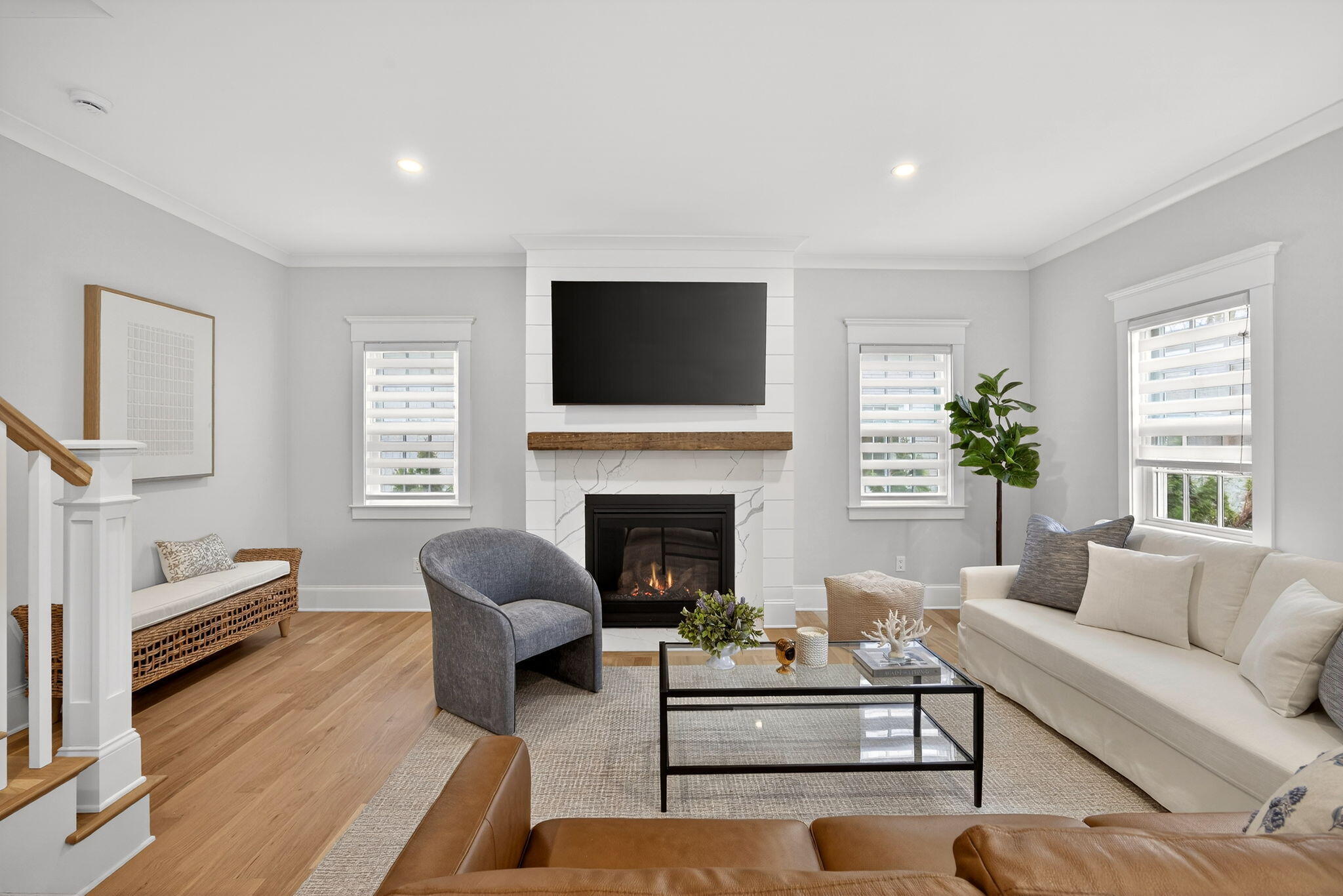 255 Old Main Road, Unit 1B North Falmouth, MA 02556 - Photo 10 of 88 a living room with furniture a fireplace and a flat screen tv
