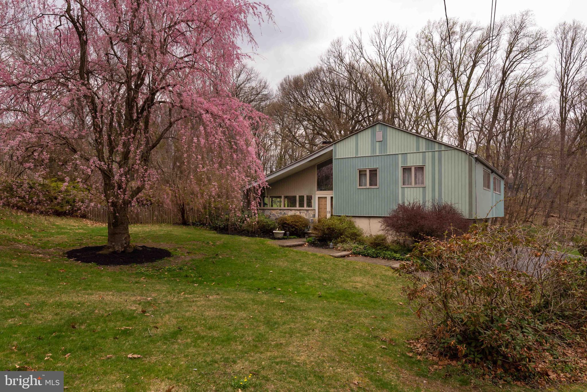 535 Upper Weadley Road Wayne, PA 19087 - Photo 2 of 44 a front view of house with garden