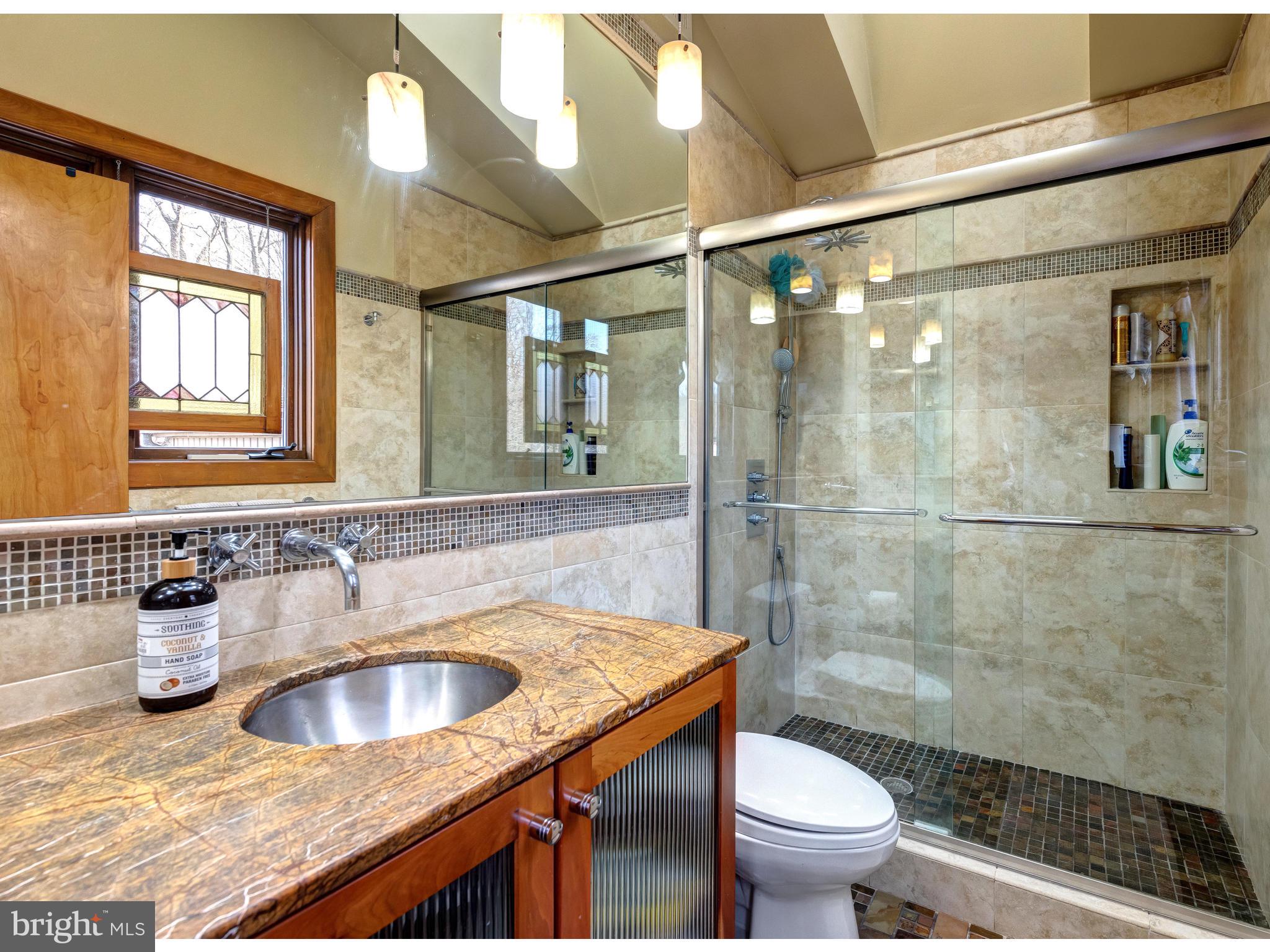 535 Upper Weadley Road Wayne, PA 19087 - Photo 29 of 44 a bathroom with a sink toilet and shower