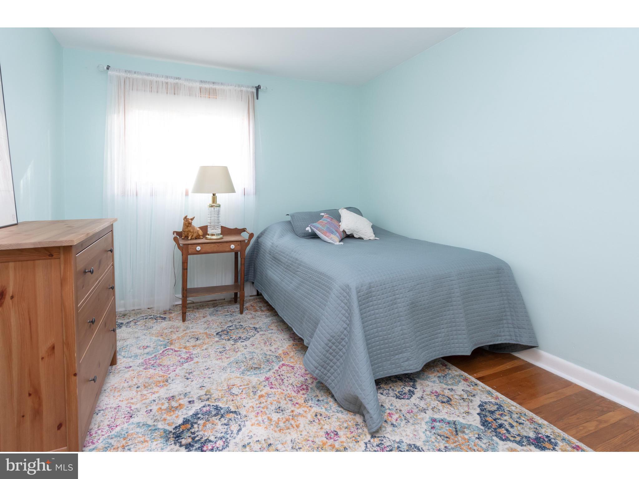535 Upper Weadley Road Wayne, PA 19087 - Photo 30 of 44 a bedroom with a bed and a window