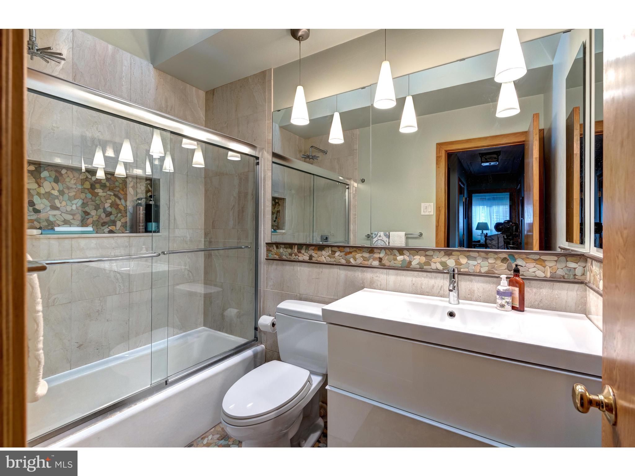 535 Upper Weadley Road Wayne, PA 19087 - Photo 33 of 44 a bathroom with a sink and a mirror