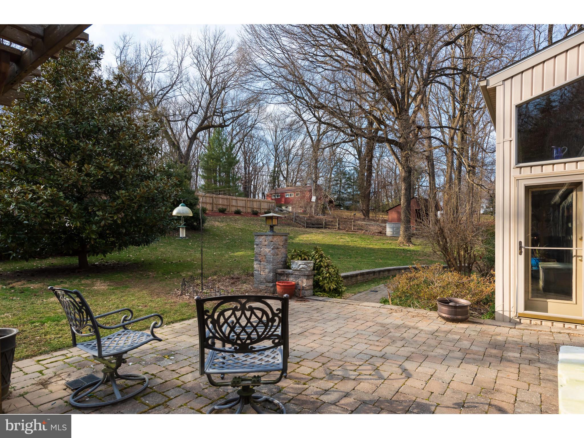 535 Upper Weadley Road Wayne, PA 19087 - Photo 39 of 44 a view of a lake with table and chairs and potted plants