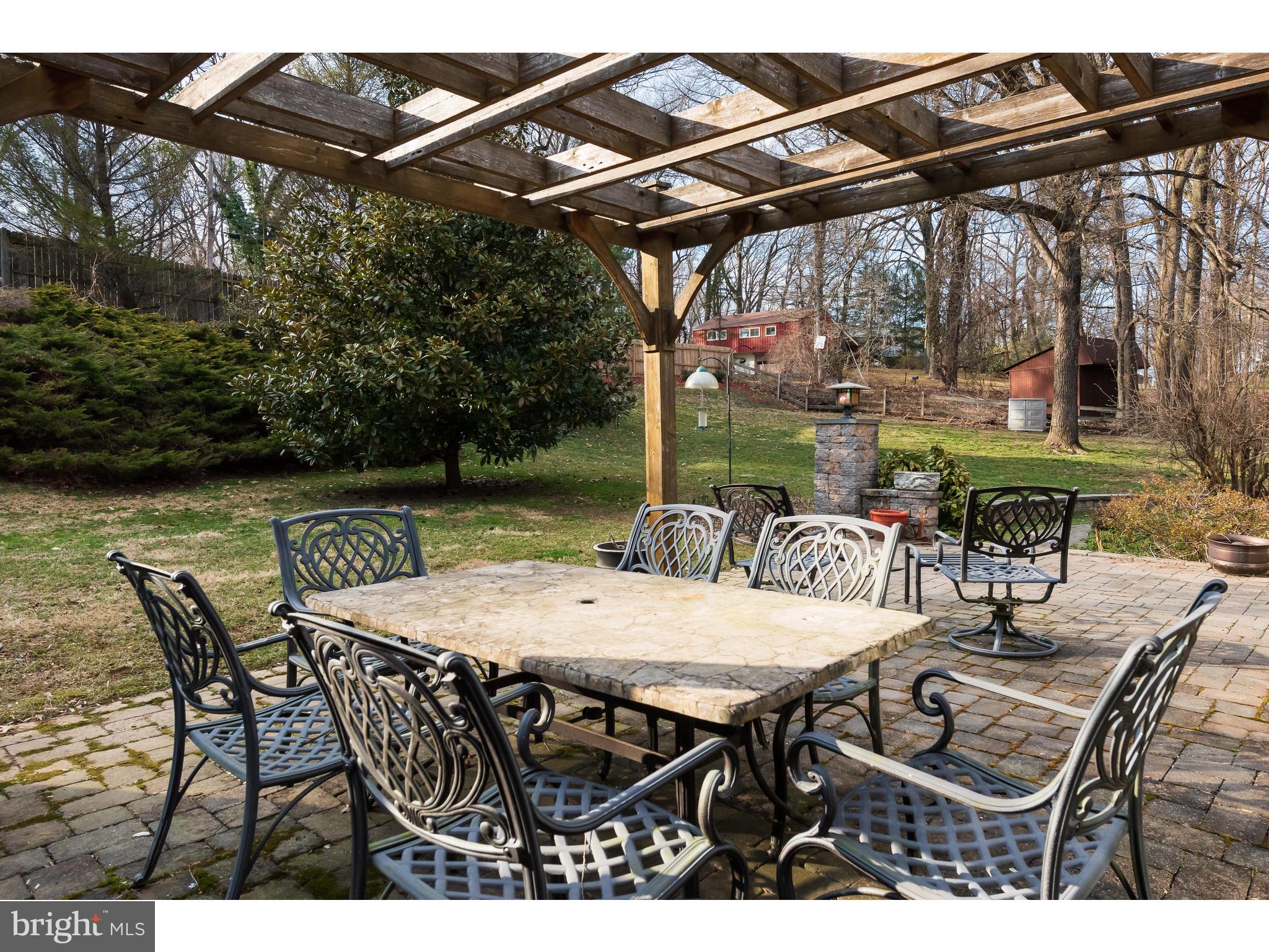 535 Upper Weadley Road Wayne, PA 19087 - Photo 40 of 44 a view of an outdoor space with furniture and umbrella